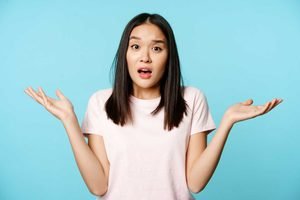 Confused Asian Girl Spread Empty Hands Sideways Shrugging Shoulders Clueless Standing Tshirt 300x200